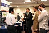 Charles Perla '13 talks with AidData staff Dan Nielson, Doug Nicholson '12 and Troy Shepley about tracking under-reported financial flows. 